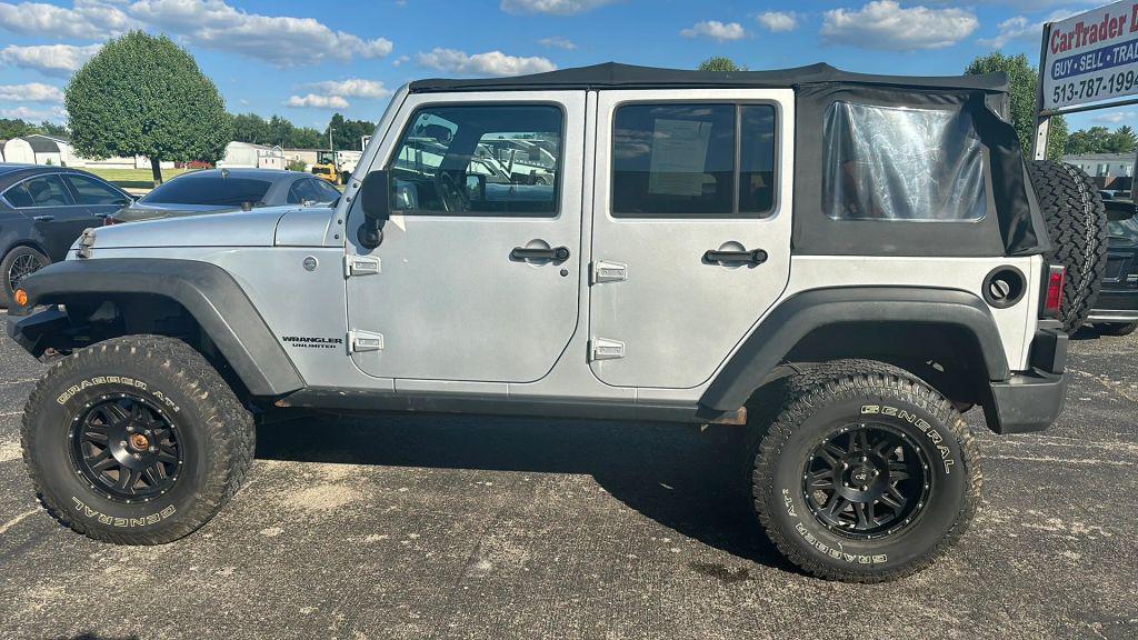 used 2011 Jeep Wrangler Unlimited car, priced at $12,995