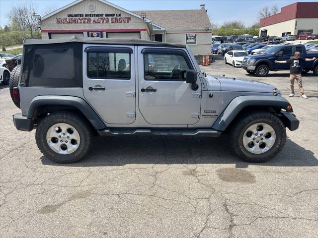 used 2013 Jeep Wrangler Unlimited car, priced at $12,495