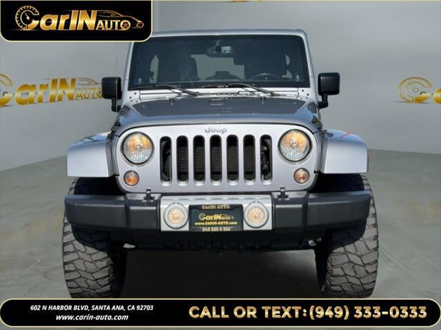 used 2014 Jeep Wrangler Unlimited car, priced at $17,990