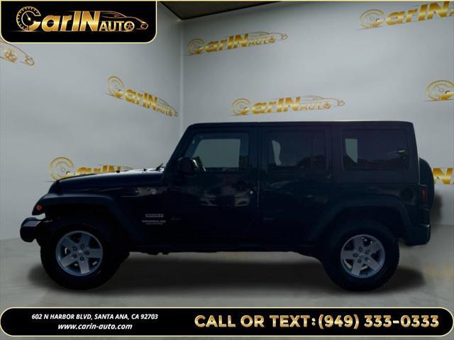 used 2013 Jeep Wrangler Unlimited car, priced at $15,990