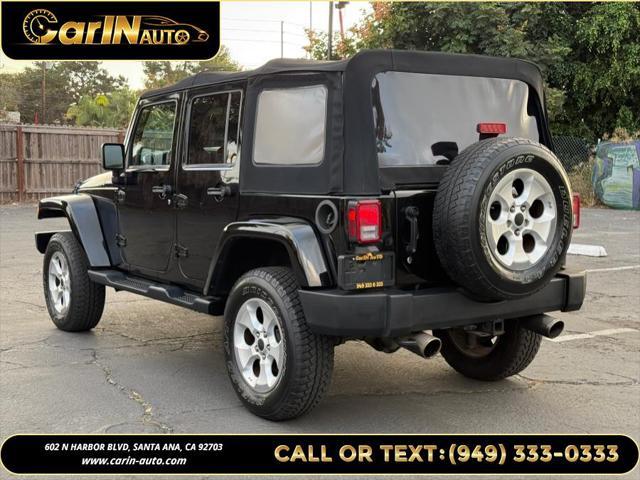 used 2014 Jeep Wrangler Unlimited car, priced at $17,490