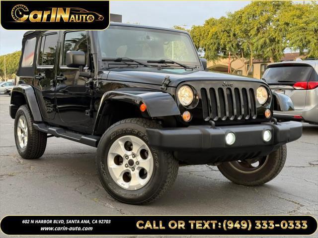 used 2014 Jeep Wrangler Unlimited car, priced at $17,490