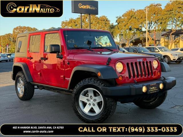 used 2011 Jeep Wrangler Unlimited car, priced at $15,990