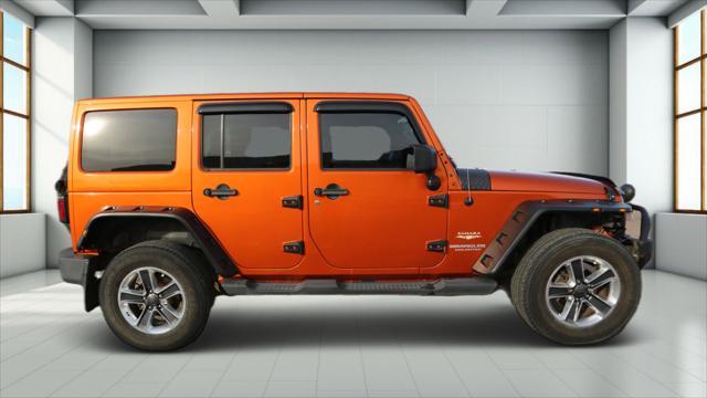 used 2011 Jeep Wrangler Unlimited car, priced at $14,999