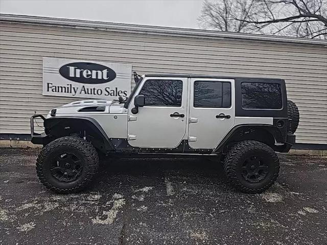 used 2011 Jeep Wrangler Unlimited car, priced at $18,956