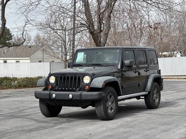 used 2011 Jeep Wrangler Unlimited car, priced at $14,995