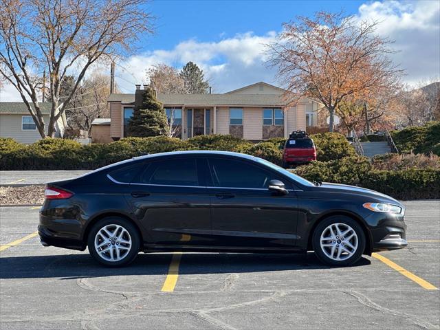 used 2015 Ford Fusion car, priced at $6,995