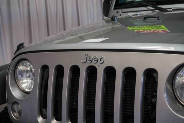 used 2016 Jeep Wrangler Unlimited car, priced at $19,455