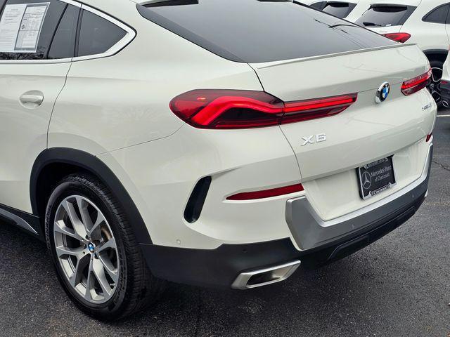 used 2023 BMW X6 car, priced at $43,877