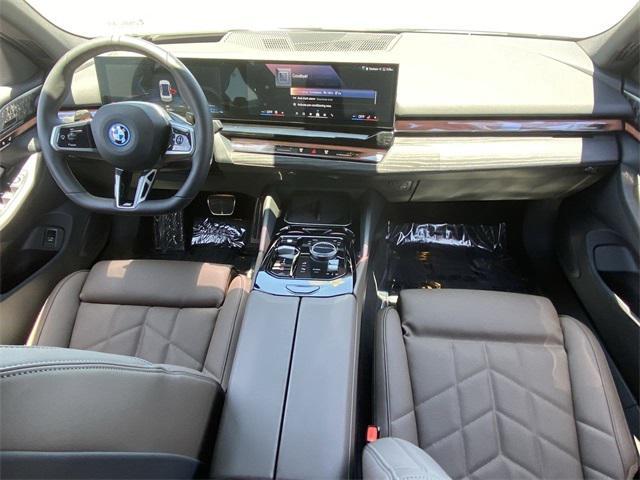 used 2025 BMW 550e car, priced at $66,291