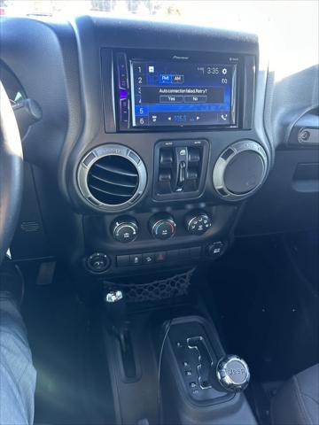 used 2015 Jeep Wrangler Unlimited car, priced at $16,988