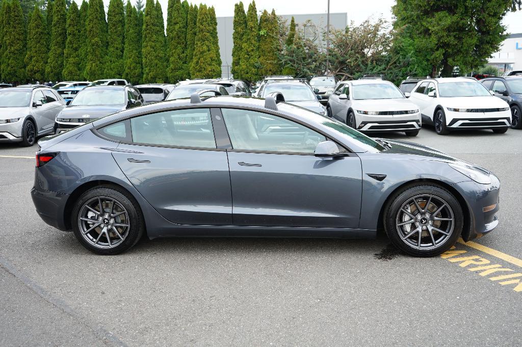used 2023 Tesla Model 3 car, priced at $27,000