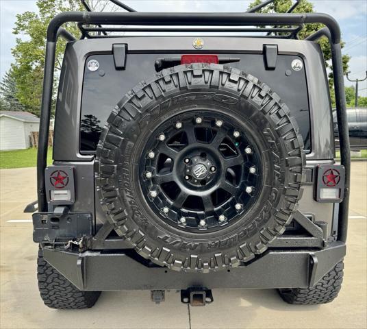 used 2014 Jeep Wrangler Unlimited car, priced at $14,870