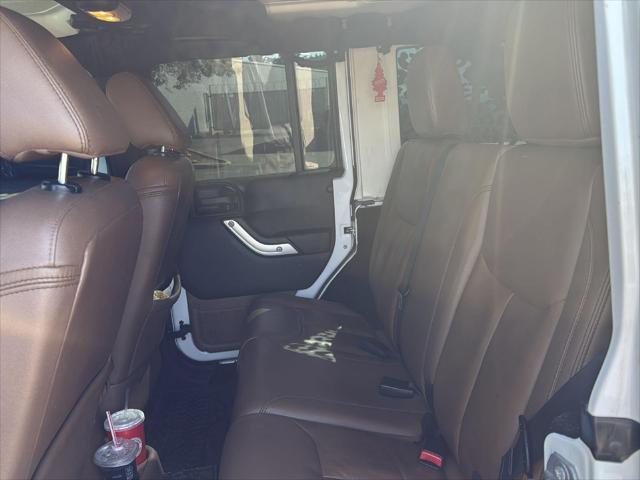used 2015 Jeep Wrangler Unlimited car, priced at $23,440