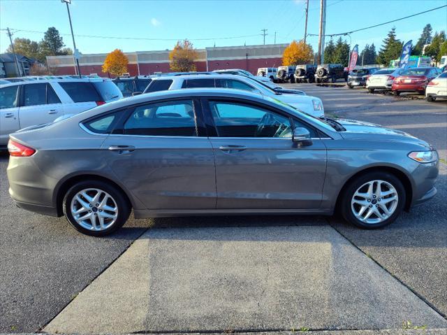 used 2014 Ford Fusion car, priced at $7,999