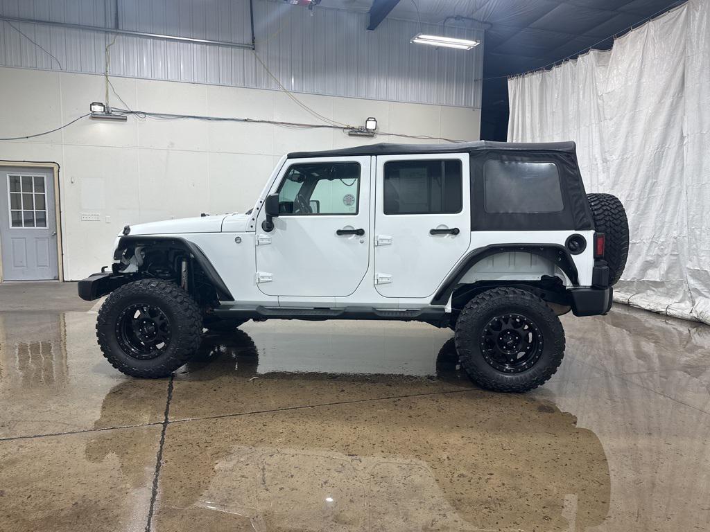 used 2013 Jeep Wrangler Unlimited car, priced at $14,250