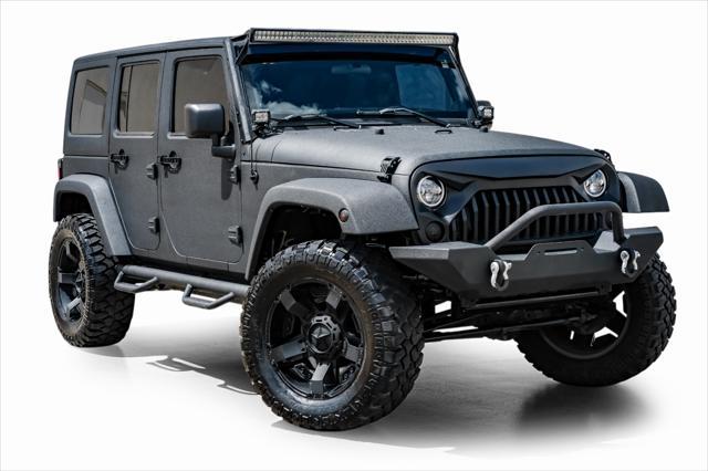 used 2012 Jeep Wrangler Unlimited car, priced at $15,499