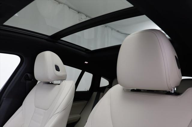 used 2023 BMW X4 car, priced at $56,177