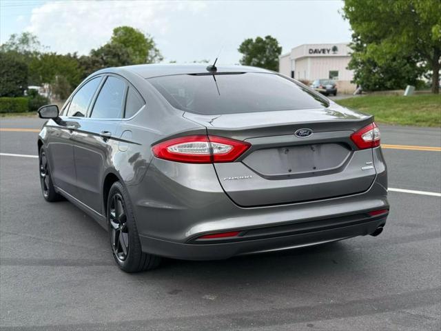 used 2014 Ford Fusion car, priced at $7,999