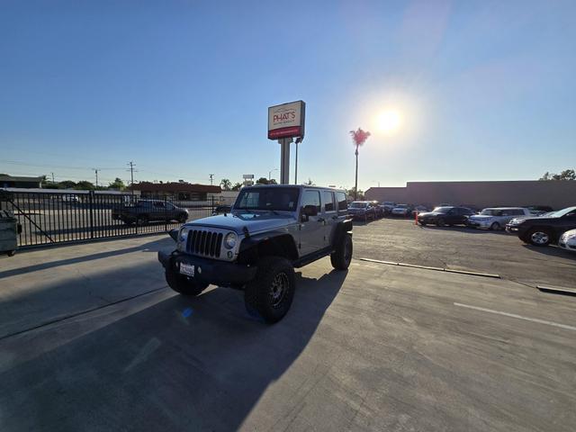 used 2014 Jeep Wrangler Unlimited car, priced at $20,995