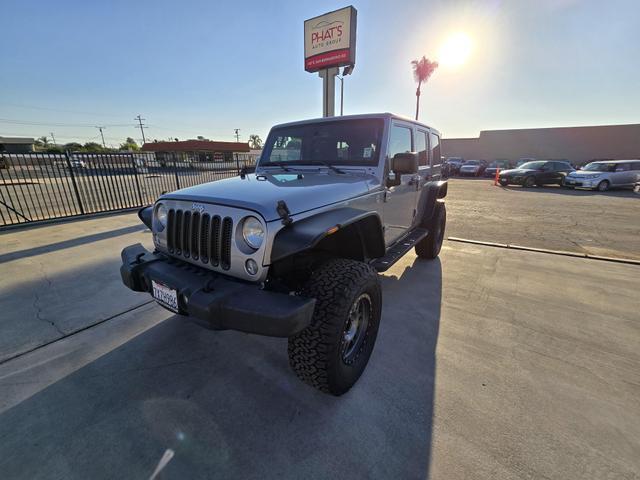 used 2014 Jeep Wrangler Unlimited car, priced at $20,995