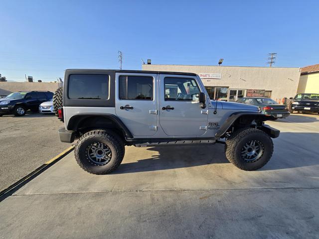 used 2014 Jeep Wrangler Unlimited car, priced at $20,995