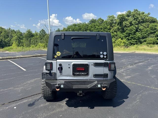 used 2014 Jeep Wrangler Unlimited car, priced at $15,681