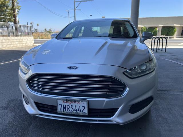 used 2016 Ford Fusion car, priced at $7,495