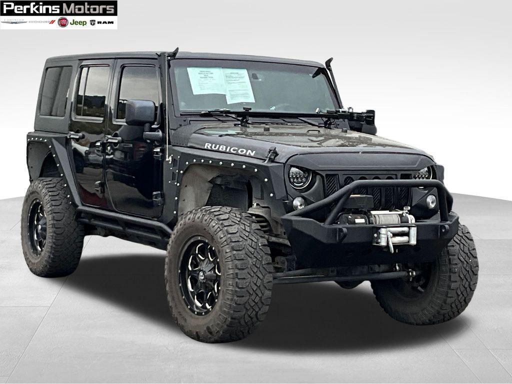 used 2014 Jeep Wrangler Unlimited car, priced at $24,594