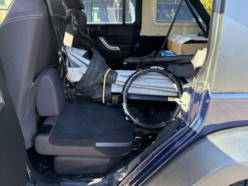 used 2013 Jeep Wrangler Unlimited car, priced at $17,952