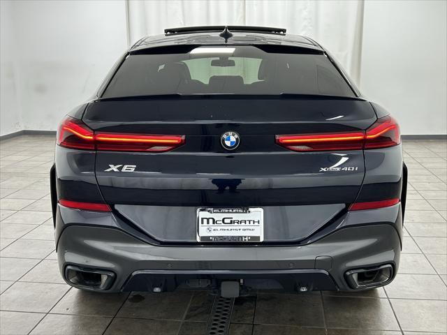 used 2023 BMW X6 car, priced at $57,201