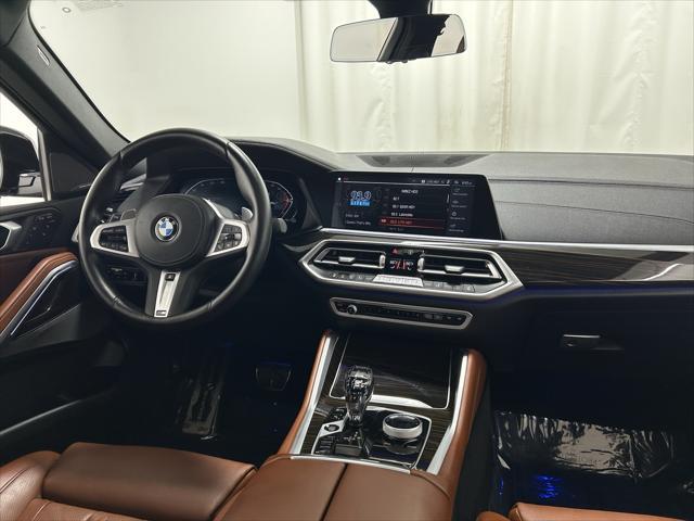 used 2023 BMW X6 car, priced at $57,201