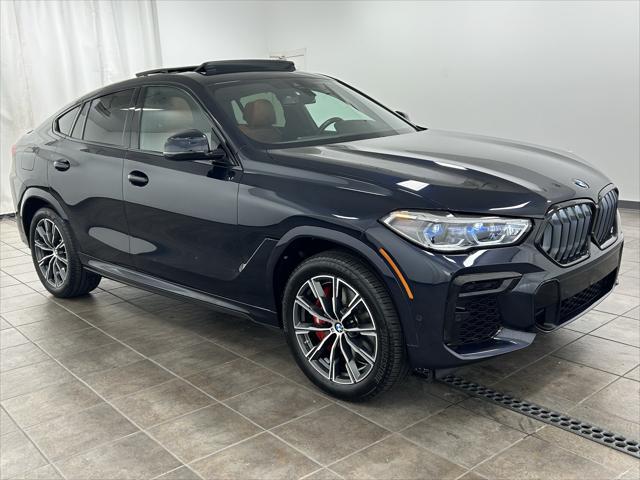used 2023 BMW X6 car, priced at $57,201