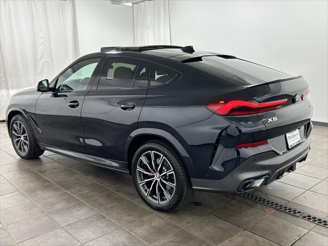 used 2023 BMW X6 car, priced at $57,201