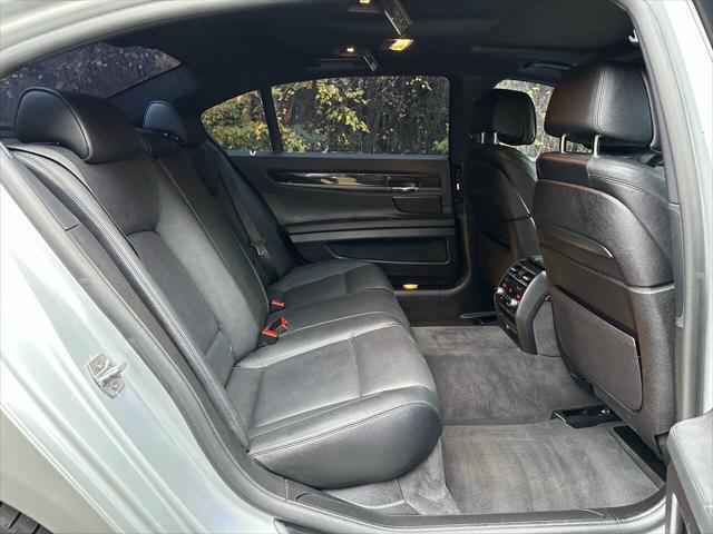 used 2015 BMW 750 car, priced at $13,495