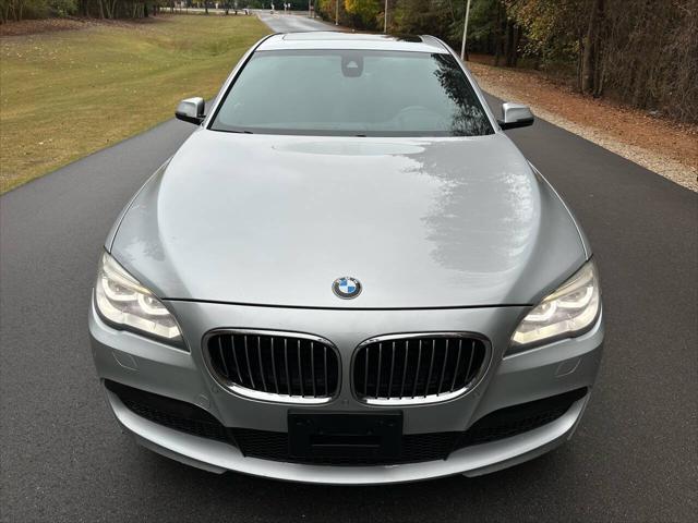 used 2015 BMW 750 car, priced at $13,495