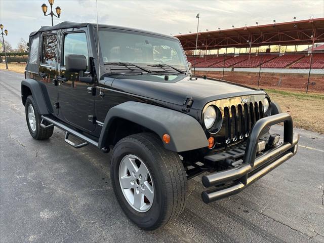 used 2011 Jeep Wrangler Unlimited car, priced at $12,495