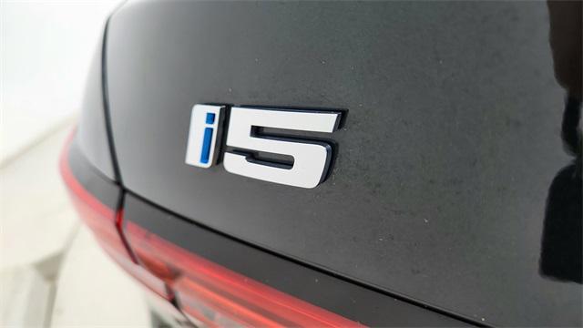 used 2024 BMW i5 car, priced at $44,950