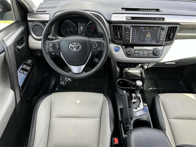 used 2018 Toyota RAV4 Hybrid car, priced at $17,400