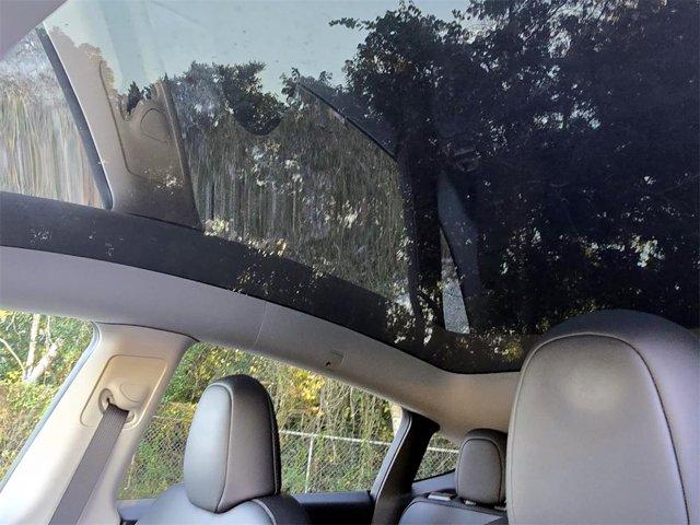 used 2023 Tesla Model Y car, priced at $28,029