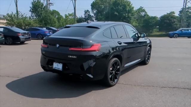 used 2025 BMW X4 car, priced at $62,102