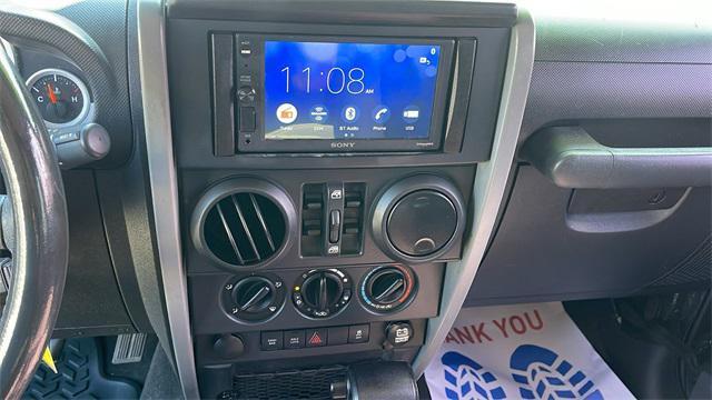 used 2010 Jeep Wrangler Unlimited car, priced at $16,647