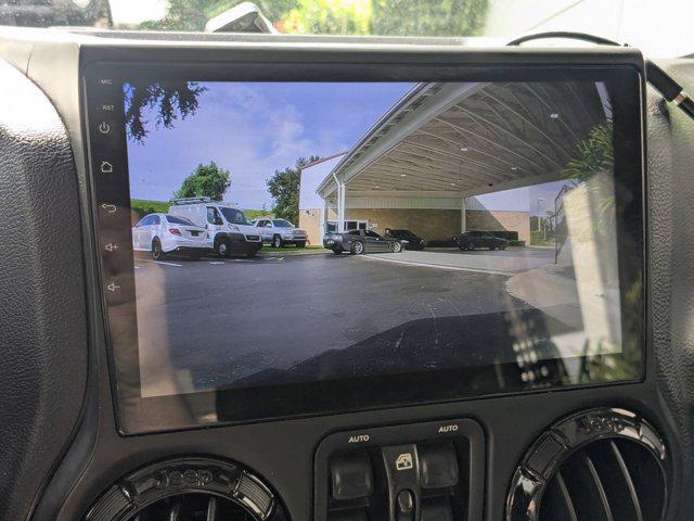 used 2015 Jeep Wrangler Unlimited car, priced at $18,724