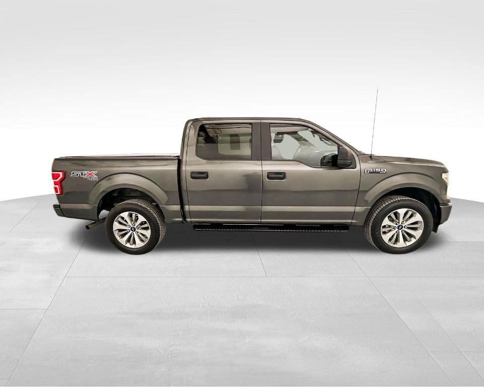 used 2018 Ford F-150 car, priced at $26,563