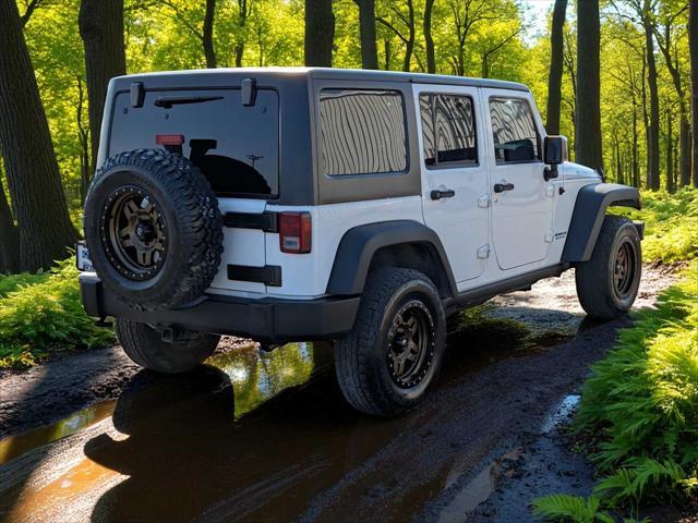 used 2011 Jeep Wrangler Unlimited car, priced at $17,795