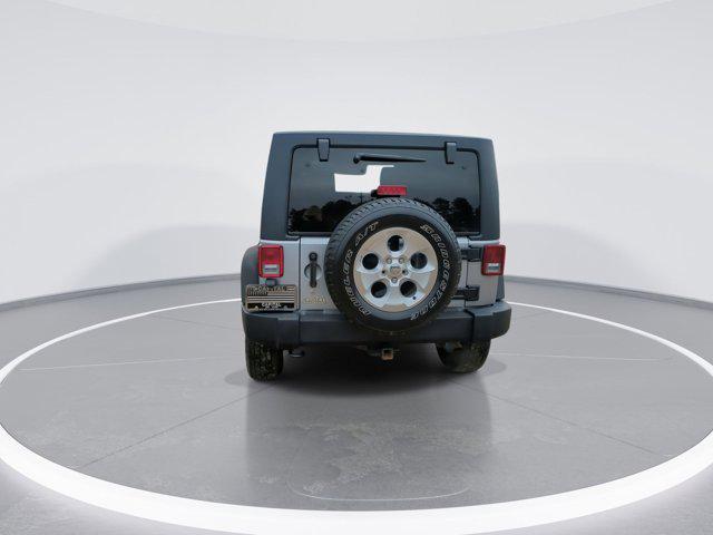 used 2015 Jeep Wrangler Unlimited car, priced at $13,130