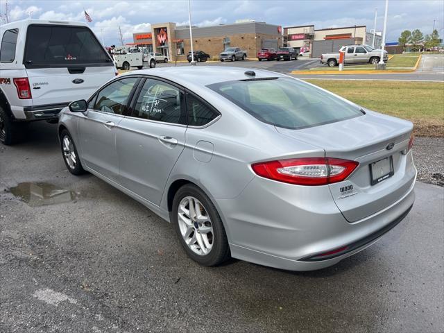 used 2014 Ford Fusion car, priced at $10,000