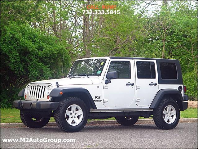 used 2009 Jeep Wrangler Unlimited car, priced at $12,000
