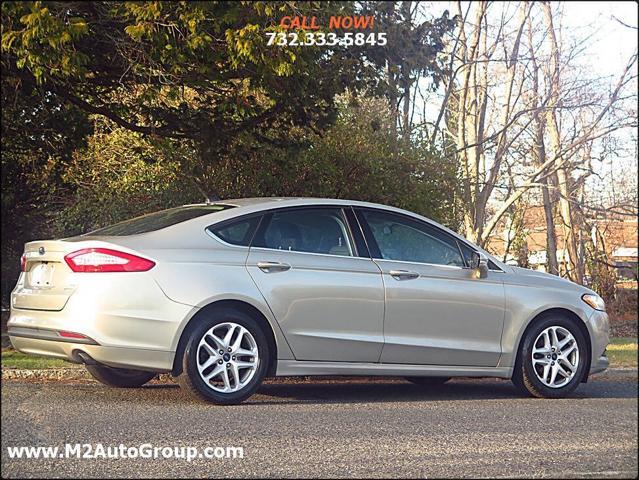 used 2015 Ford Fusion car, priced at $5,900