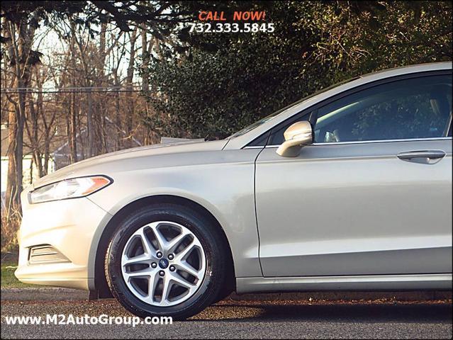 used 2015 Ford Fusion car, priced at $5,900